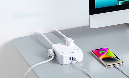 anker-341-usb-power-strip-on-a-table-charging-a-phone-and-giving-energy-to-a-computer.jpg